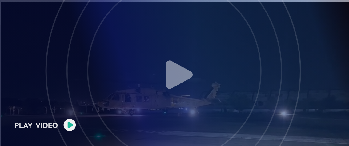 IDF Helicopter on the ground at night with the text "Play Video" on the bottom left and a play icon on the center of the image.