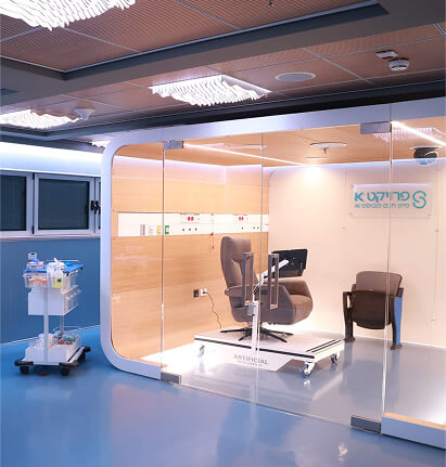 Project K exam room at Sheba Medical Center featuring an AI avatar interface for real-time patient interaction